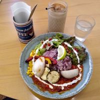 Burrito bowl with grilled veggies (as they were out of avocado), cold chai latte and lemon / cucumber water. at Healthy Penguin Cafe in Matsumoto
