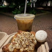 Iced vanilla & cinnamon latte with a macaroon & almond croissant  at Fox & Fig in Savannah
