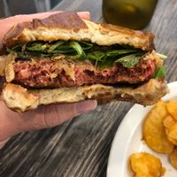 Beyond Meat Burger with delicious pretzel bun and caramelized onions at Fox & Fig in Savannah