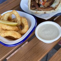 Onion rings with tahini side  at What The Pitta in North West London