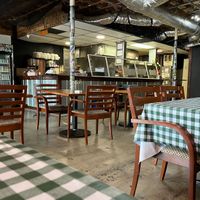 Interior, employee visibly smiling at Murray Hillbilly in Jacksonville
