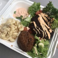 Ya’ Reckon on a salad with Mac n’ cheez and a hush puppy  at Murray Hillbilly in Jacksonville