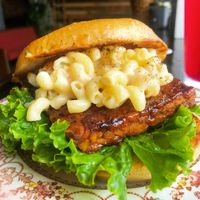 Darn Tootin sandwich. BBQ tempeh topped with house-made mac n' cheeze on lettuce and tomato. at Murray Hillbilly in Jacksonville