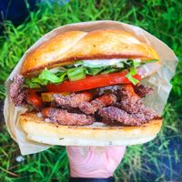 Spicy Chickun Fry sandwich. Non-gmo soy curls deep fried to perfection on a freshly baked focaccia bun with vegan mayo, lettuce, tomato, and a splash of hot sauce. at Murray Hillbilly in Jacksonville