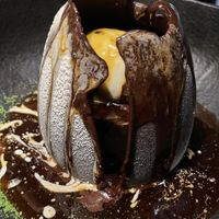 The chocolate egg filled with dreams (or a chocolate cream tarte and vanilla ice cream), melted by caramel sauce   at Wild Food in Granada
