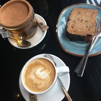 Peppermint tea, soy milk coffee, gluten free / vegan banana bread. at Wild Food in Granada