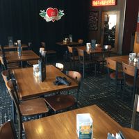 Dining area with the closed stage in the background. at Pizza Luce in Duluth