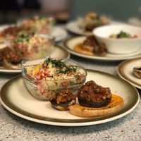 Cauliflower couscous with stuffed mushrooms and oven-cooked pumpkin rings. at Groenten Zonder Grenzen - GZG in Rotterdam