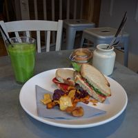 Spring Green Smoothie [£3.50] - Apple, Pear, Spinach, Avocado & Agave with Roasted Red Pepper Rocket & Hummus Sourdough Sandwich with Vegetable Crisps [£5.75]  at Kalm Kitchen Cafe in Guildford