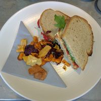 Roasted Red Pepper Rocket & Hummus Sourdough Sandwich with Vegetable Crisps [£5.75]  at Kalm Kitchen Cafe in Guildford