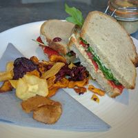 Roasted Red Pepper Rocket & Hummus Sourdough Sandwich with Vegetable Crisps [£5.75]  at Kalm Kitchen Cafe in Guildford
