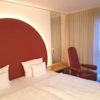 Bed in a standard room  at Arcotel Rubin in Hamburg