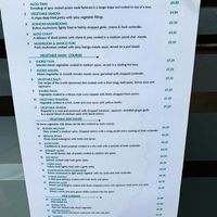 New vegan menu advertised in window 💚 at Cumin Club in Rochester