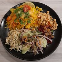 Panang Thai curry, Vietnamese Som Tam salad, beetroot quinoa, apple coleslaw. at Anne's Vege in Espoo