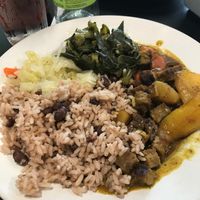 Vegan curry goat, rice n peas, cabbage, plantain, and collard greens.  at Island Delight at Dexter in Montgomery