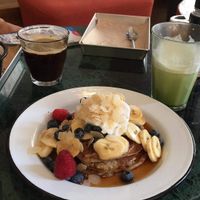 Pancakes, matcha latte and coffee. at TICH Healthy Living in Brussels