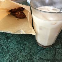 Vegan peanuts and chocolate cookie and an iced chai latte at TICH Healthy Living in Brussels