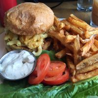 Veggie burger topped with mac n cheez, spicy fries on side.   at Vertical Diner in Salt Lake City