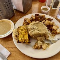 Biscuit brekkie sandwich with a side of gravy  at Vertical Diner in Salt Lake City