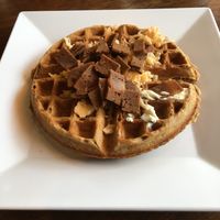 Vegan Bacon Cheddar waffle. Nice smokey flavor that pairs nicely with maple syrup and vegan butter. at The Buzz Coffee & Cafe in Burnsville