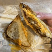 Reuben; Toasted rye topped with corned seitan, sauerkraut, 1000 island dressing, and provolone cheese  at LUHV Vegan Deli in Philadelphia