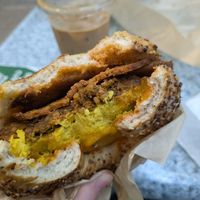 breakfast sandwich with sausage AND bacon with Sriracha at LUHV Vegan Deli in Philadelphia