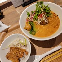 Golden sesame ramen with bowl of rice and soy meat at T's Tantan - Ecute Ueno in Tokyo