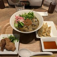 Black sesame ramen, char siu, and dumplings   at T's Tantan - JR Ueno in Tokyo