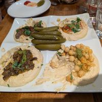 Hummus sampler with pickles at Hummus Place - Upper West Side in New York City