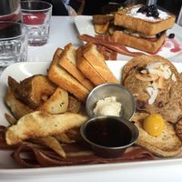 Doug's slam platter (forefront, $17) - Stuffed french toast (back, $16) at Mythology in Toronto