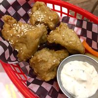 Wings with honey garlic sauce at Mythology in Toronto