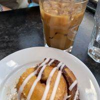 Cinnamon roll (started eating before the picture) and iced espresso with oat milk and vanilla  at City O' City in Denver