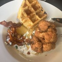 Chkn fried cauliflower and waffles with carrot bacon 🤌🏼  at City O' City in Denver