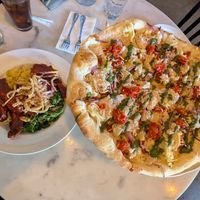 BBQ bowl with tofu and seitán (left), Sausage and Pesto Pizza with cashew cheese (right) at City O' City in Denver