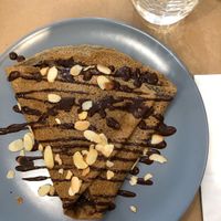 Vegan crêpe with banana, homemade chocolate sauce, and sliced almonds  at Crep'o'rama in Albi