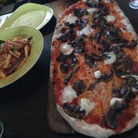 Pizza and pasta dish at Zambretto Italian - Old Sneddon St in Paisley