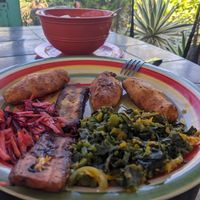 A very tasty vegan porridge, callaloo, fried plantains, cornmeal biscuits,  and other delights for breakfast. at Ini Ital Rastarant in Negril