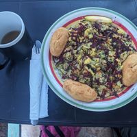 Bush tea and rasta pasta (vegan) with cornmeal biscuits for lunch. at Ini Ital Rastarant in Negril