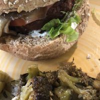 Beyond Meat and aubergine burger and broccoli as a side at L'Orto Bistrot in Turin