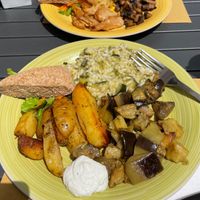 Far: soy protein, cabbage, mushrooms. Near: potatoes, eggplant, rice.
Each lunch portion includes one main dish and two sides. Both served with savory cream sauce and bread. at L'Orto Bistrot in Turin