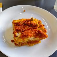 Small, sad lasagna (the plate is a breakfast plate) at L'Orto Bistrot in Turin