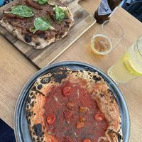 Pinsa Tapenade and Pizza Marinara di Vegazzi at Vegazzi Specialty Pizzeria in Budapest