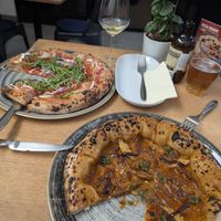 Sausage pizza and BBQ pizza at Vegazzi Specialty Pizzeria in Budapest