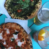 Pesto pizza and cheese pizza at Vegazzi Specialty Pizzeria in Budapest