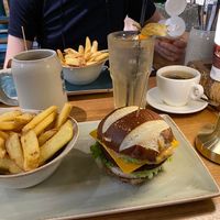 Avocado vegan burger - see that chez slice? It’s so so cheezy.  Pretzel bun.  at Hans im Glück in Central Singapore