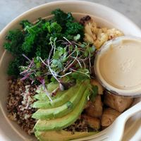Vegan bowl with tri-coloured quinoa, baked tofu, kale, cauliflower + roasted red pepper, avocado, microgreens and tahini citrus miso dressing at Honest Mary's in Austin