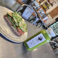 Avo toast with extra fixings and a green juice at Swami Juice in Plantation