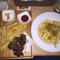 Vegan fish and chips and vegan poutine  at Slices in Osaka