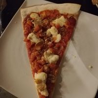 Slice of vegan "pepperoni" pizza at Slices in Osaka