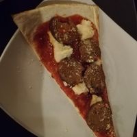 Slice of vegan pepperoni pizza at Slices in Osaka